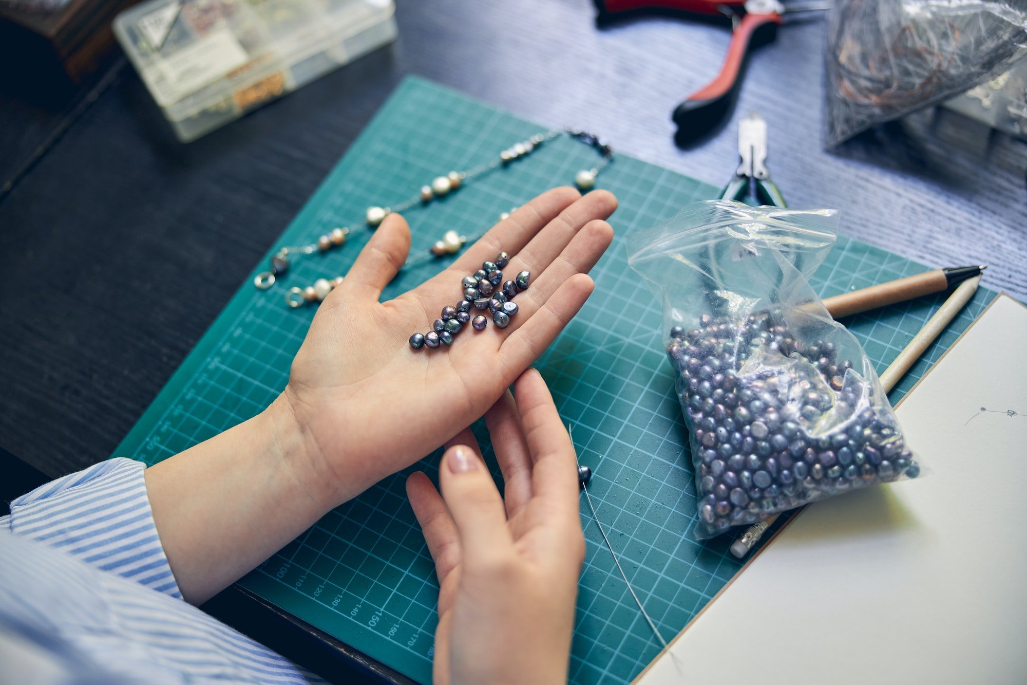 Jewelry expert holding material for a new product creation